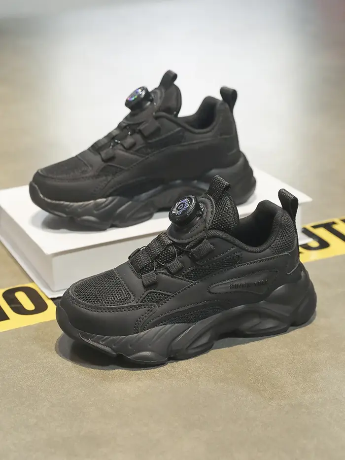 Boucle rotative à enfiler! Chaussures de sport noires en mesh pour enfants, respirantes et anti-chau