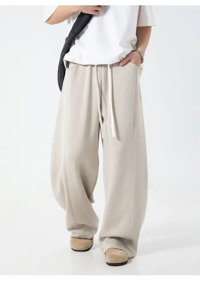 Pantalon décontracté texturé à coutures fendues pour hommes, surdimensionné, jambes incurvées, drapé